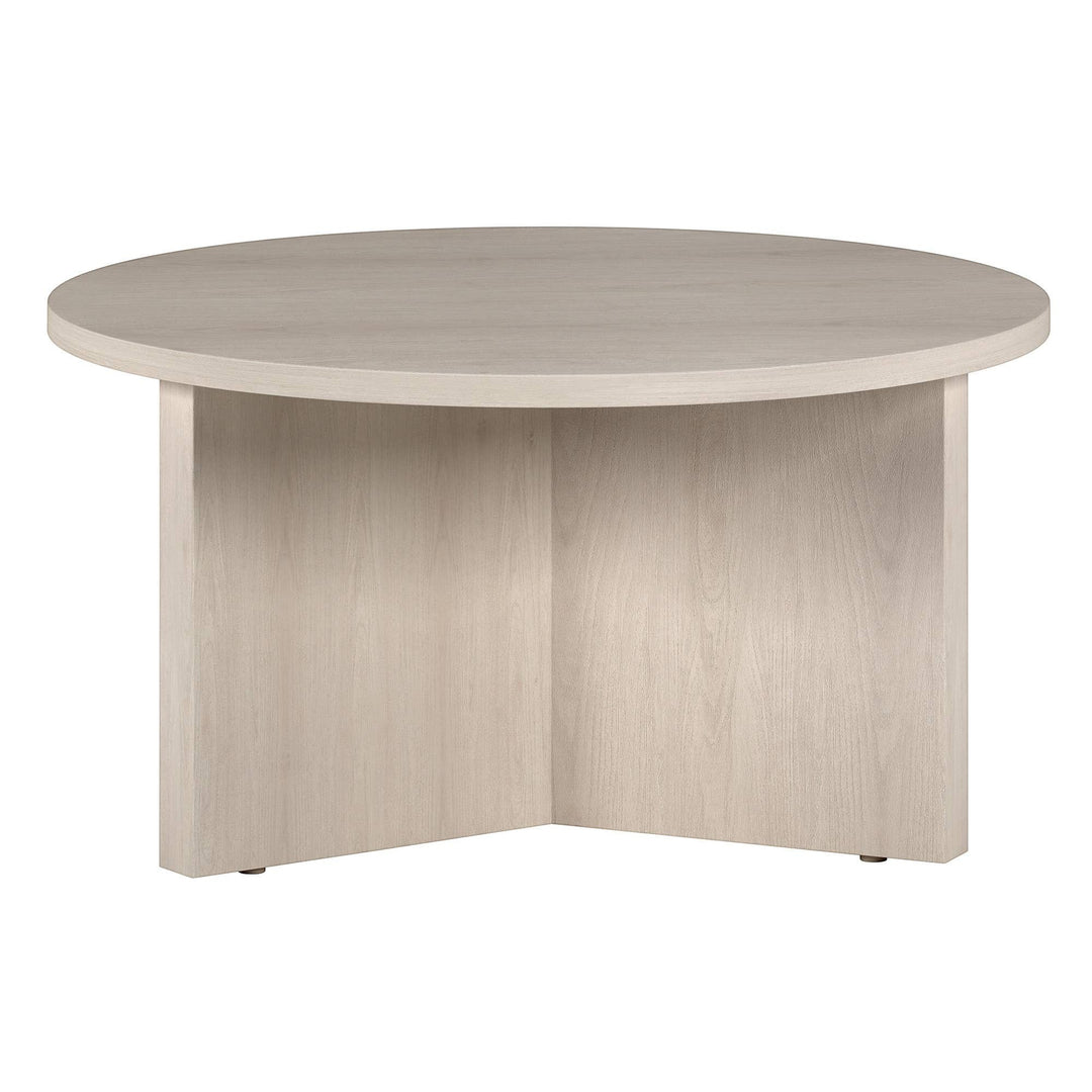 Chic Collective 32-inch round coffee table in light wood finish with a modern, minimalist design.