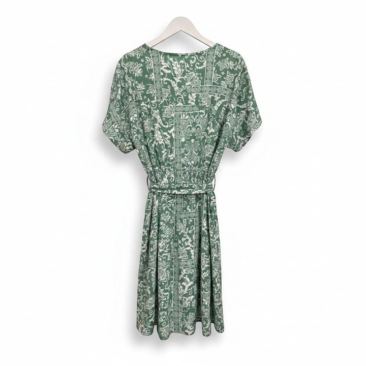 Chic Collective sage green boho surplice romper with short sleeves, wrap-style bodice, elasticated waist, and tie belt. Features a white paisley and geometric print.
