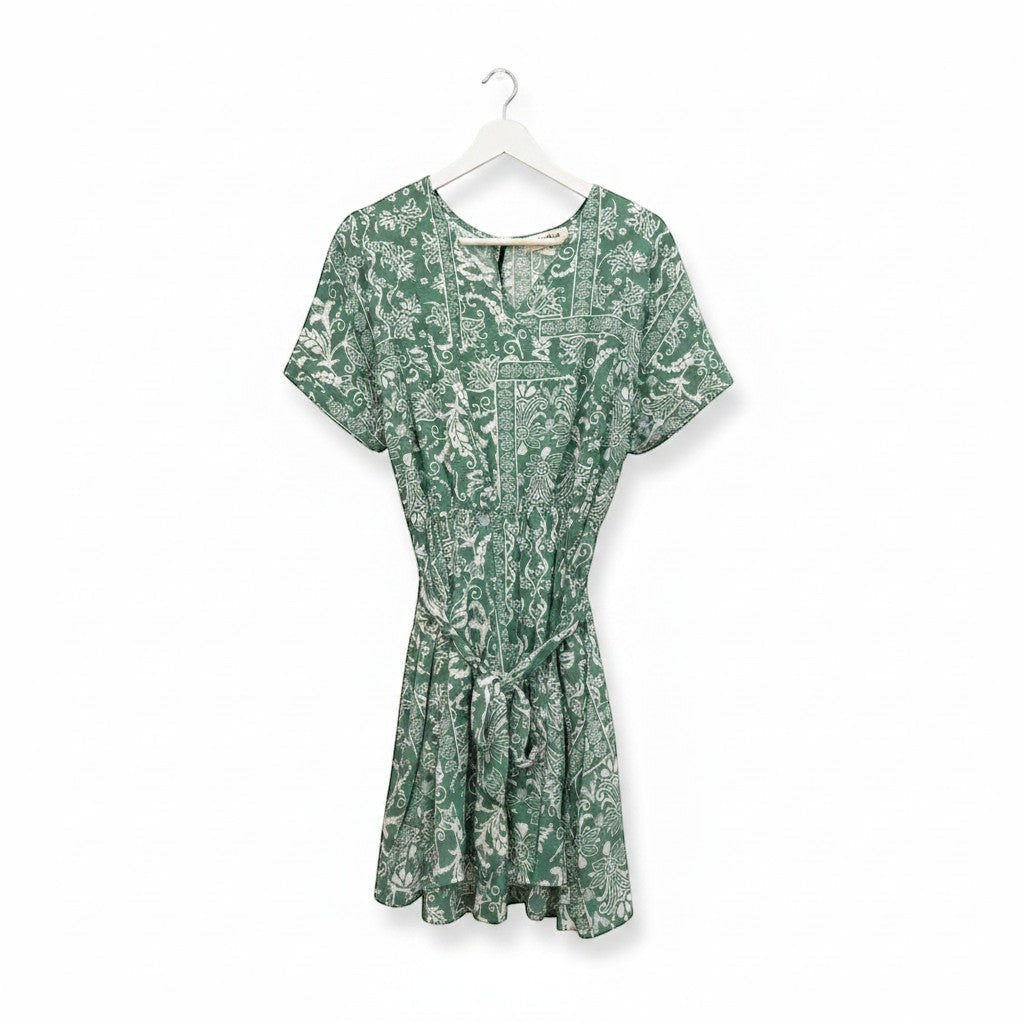 Chic Collective sage green boho romper with white paisley print, V-neck, short sleeves, tie waist, and pockets.