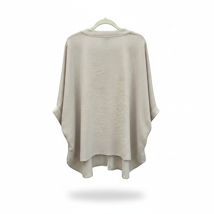 Chic Collective sand beige woven top with V-neck and puff half sleeves, featuring a relaxed fit and textured fabric.