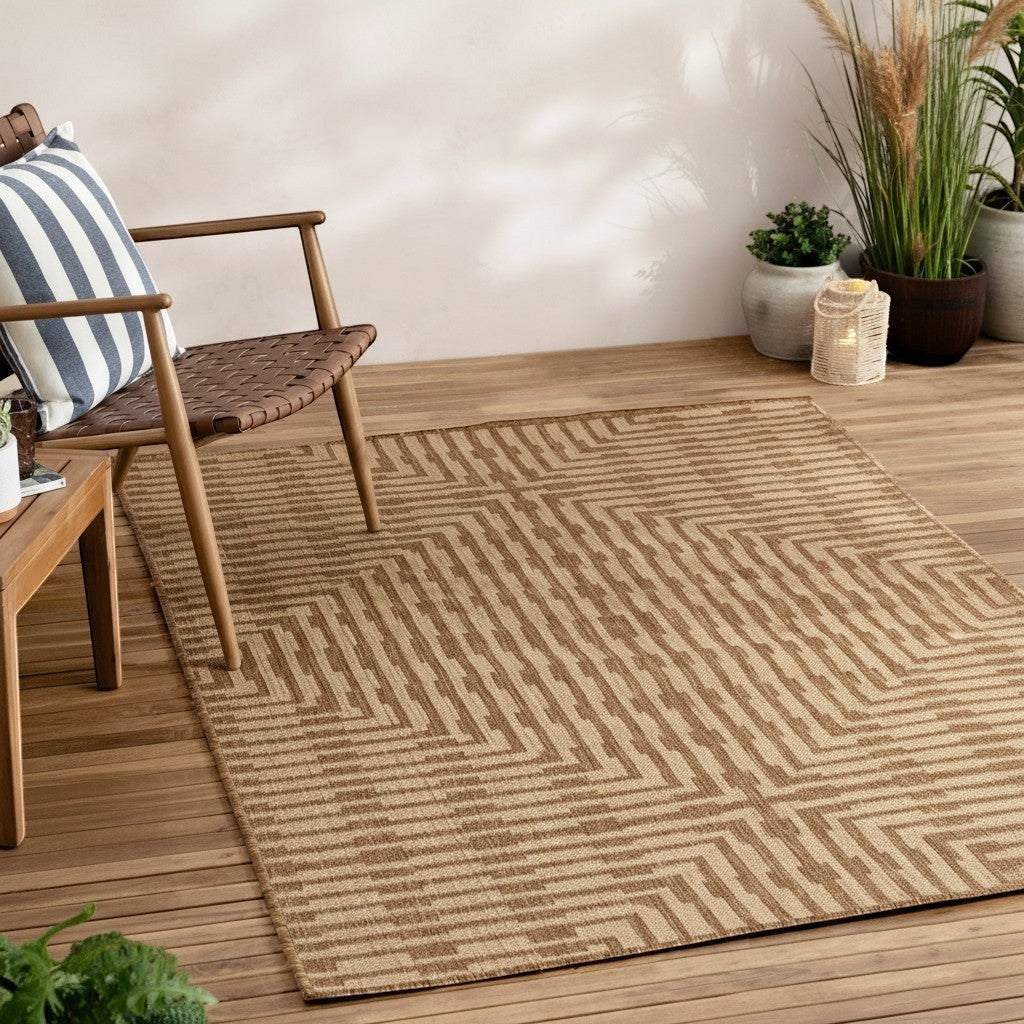 Chic Collective Sandown natural jute effect rug with geometric pattern on wooden deck.