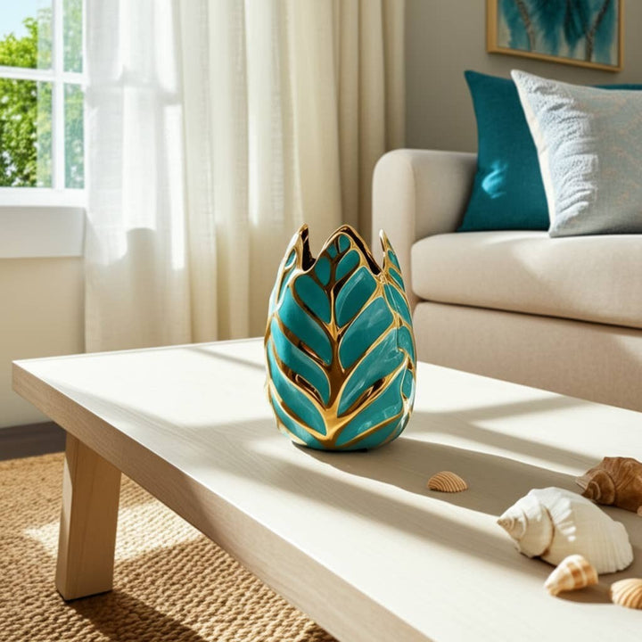 Chic Collective teal and gold leaf-shaped stoneware vase with a glossy finish, 8 inches tall.