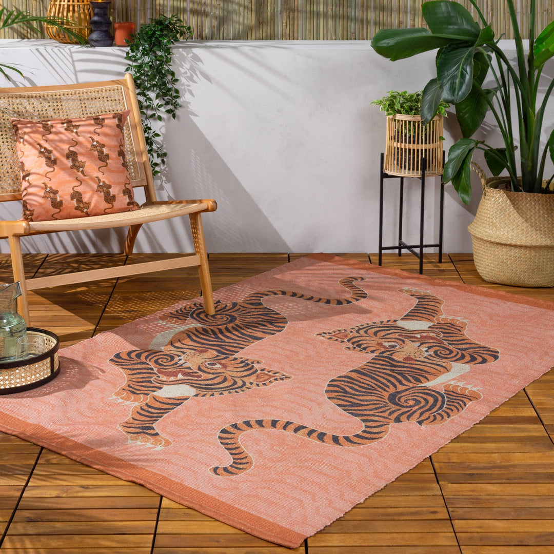 Chic Collective coral orange polyester flatweave rug with two Tibetan tigers design, 120x170cm.