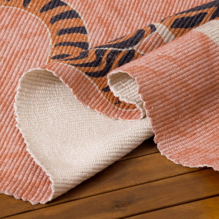 Chic Collective coral orange Tibetan tiger rug, polyester flatweave, 120x170cm, washable, indoor/outdoor use.