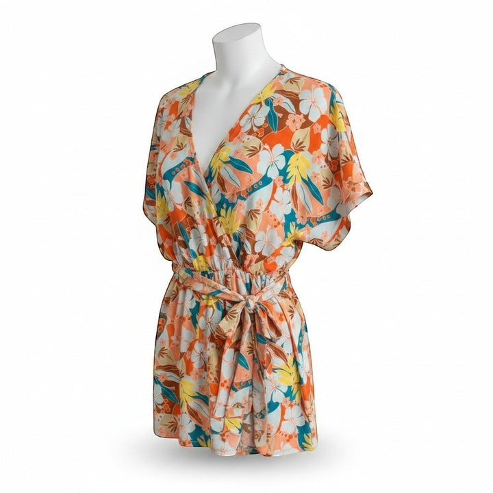 Chic Collective orange, blue, and yellow floral print dolman sleeve romper with surplice neckline and tie waist.