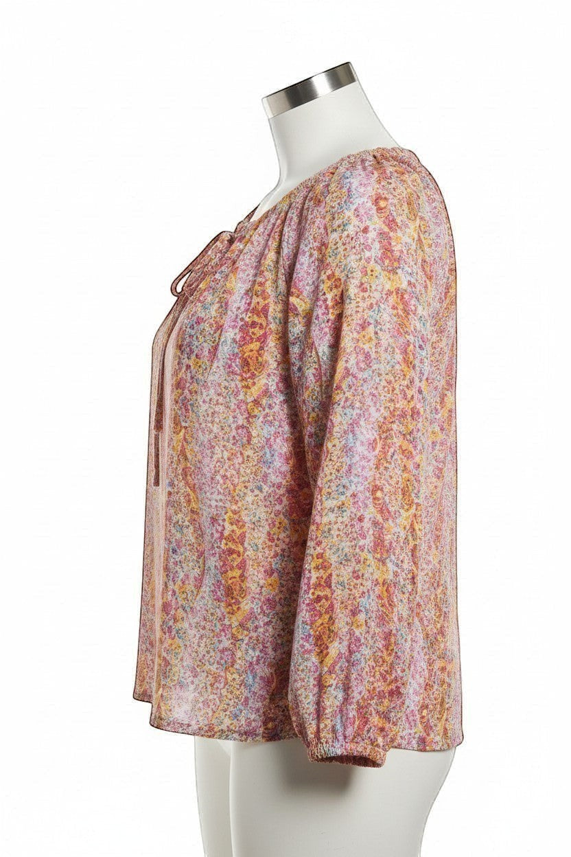 Chic Collective watercolor floral print blouse with keyhole front and tie detail. Pink, yellow, and blue floral pattern on lightweight fabric.