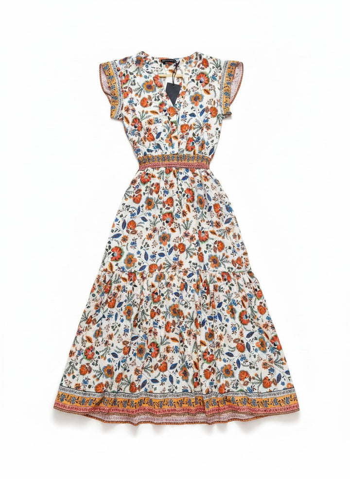 Chic Collective white maxi dress with orange and blue floral print, V-neck, smocked waist, and tiered skirt.
