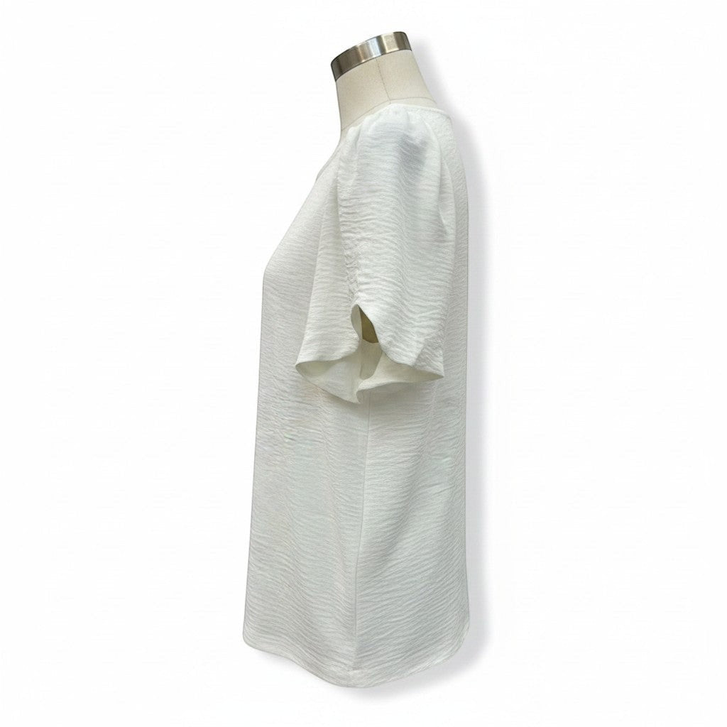 Chic Collective white ivory woven blouse with short flutter sleeves and textured fabric.