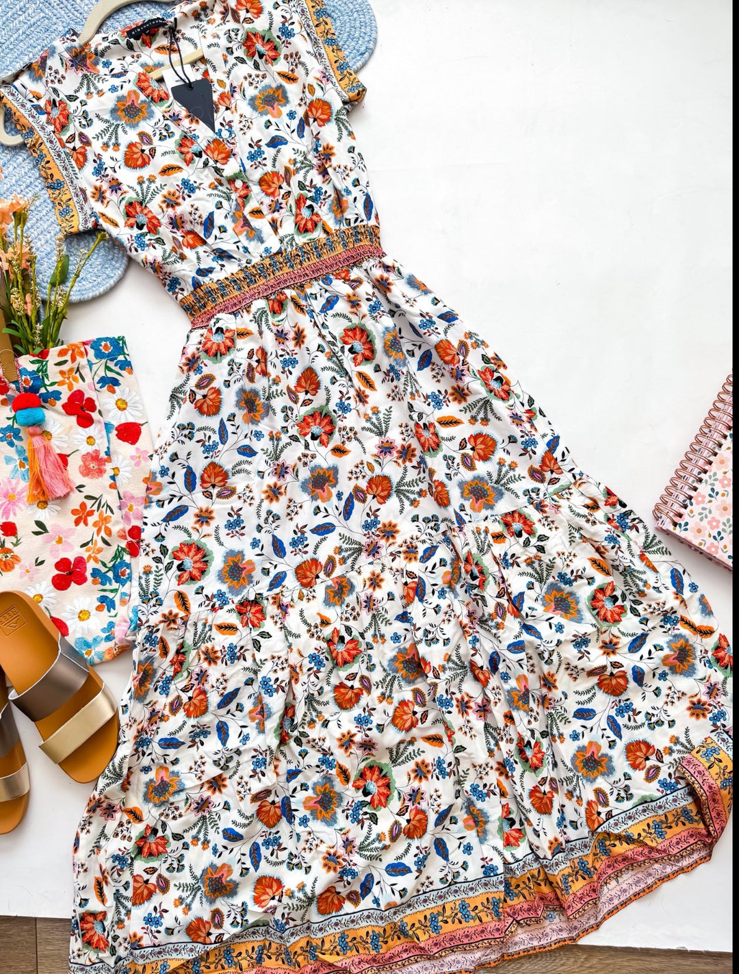 Chic Collective white maxi dress with a vibrant floral paisley print, V-neck, elasticated waist, and tiered skirt.