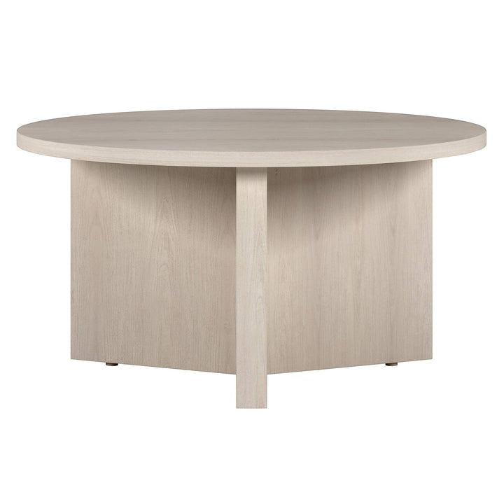 Chic Collective 32-inch round white manufactured wood coffee table with a minimalist design and sturdy construction.