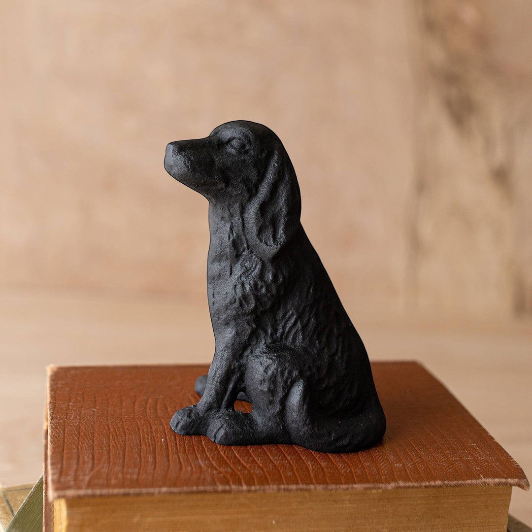 Chic Collective black cast iron sitting dog decorative accent with textured fur detail.